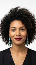 Load image into Gallery viewer, Woman with curly hair wearing Sasha L Jewels Triple Teal green earrings 