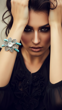 Load image into Gallery viewer, Woman wearing a Sasha L Jewels decorative turquoise flower bracelet with a large stone and turquoise beads.
