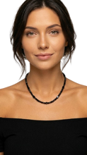 Load image into Gallery viewer, Woman wearing a Sasha L Jewels  black beaded stone necklace against a plain background