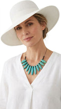 Load image into Gallery viewer, Woman wearing a white hat and Sasha L Jewels turquoise necklace Hamptons Newton Beach Style