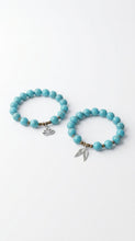Load image into Gallery viewer, Two Sasha L Jewels turquoise beaded bracelets with charms on a white background