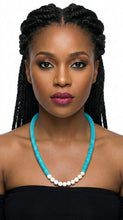 Load image into Gallery viewer, Woman wearing a black strapless top and Sasha L Jewels turquoise beaded necklace 