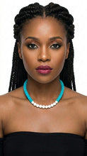Load image into Gallery viewer, Woman wearing a black strapless top with Sasha L Jewels turquoise necklace. 