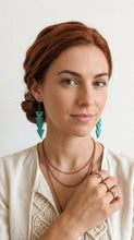 Load image into Gallery viewer, Woman wearing Sasha L Jewels Boho Chic Collection turquoise earrings and a necklace