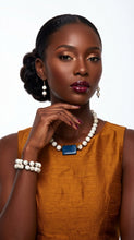 Load image into Gallery viewer, Woman wearing a mustard yellow dress with Sasha L Jewels Boho Chic Collection jewelry